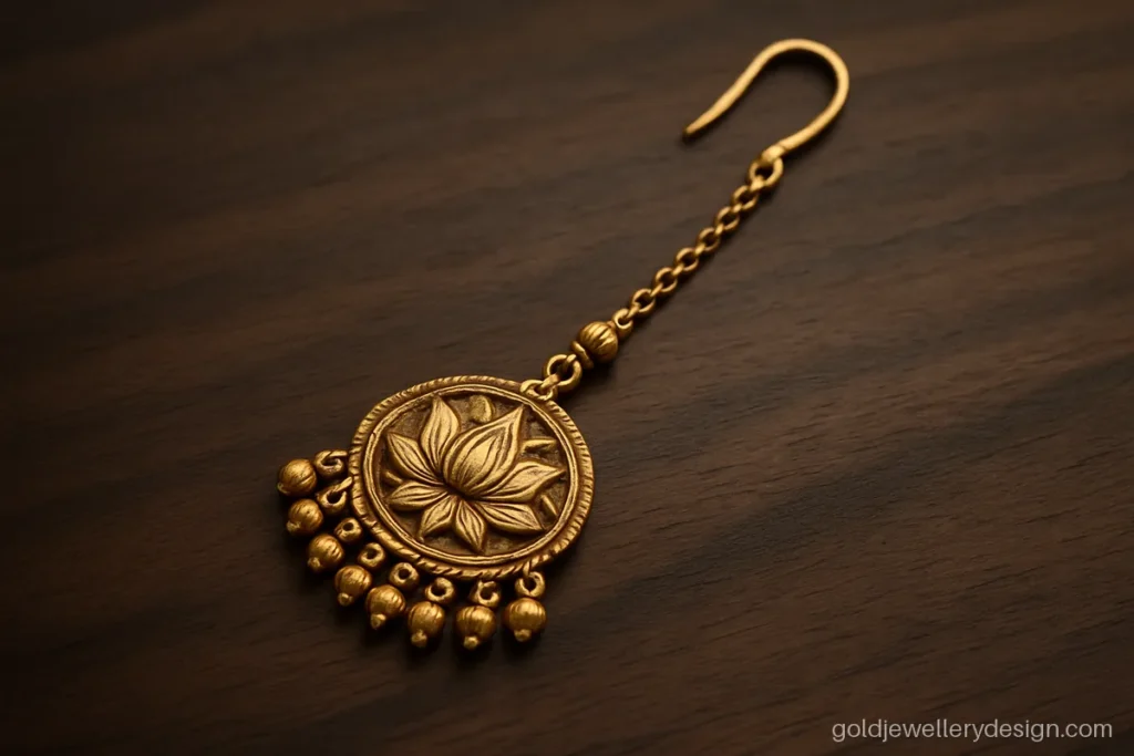 Bridal gold tikka with carved lotus pendant and small gold bead drops