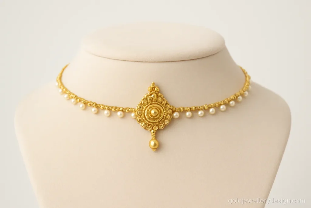 Light matha patti with single pearl strand and small round tikka