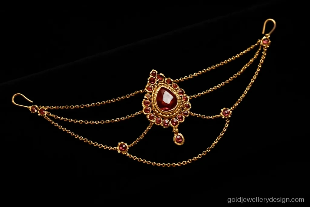 Gold matha patti with three side strands, ruby links and centre tikka