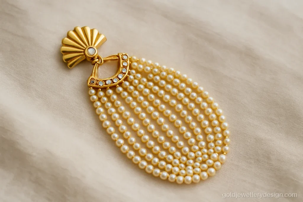 Gold pasa design with fan shape and layered strands of pearls