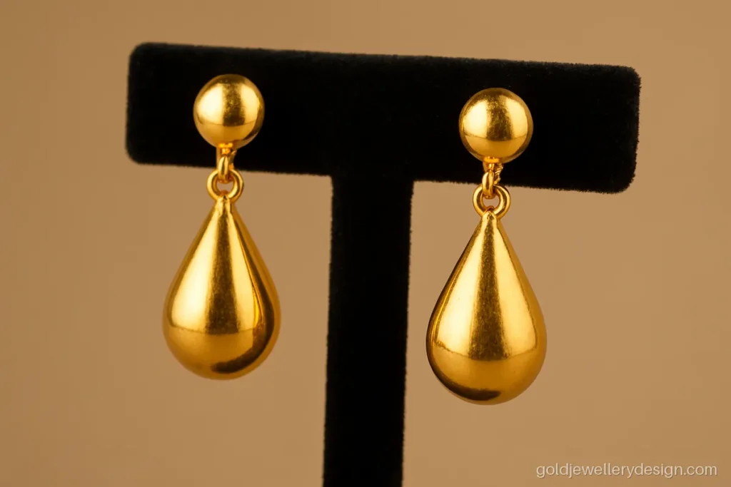 3 gram gold earrings new design with a hollow teardrop hanging from a stud