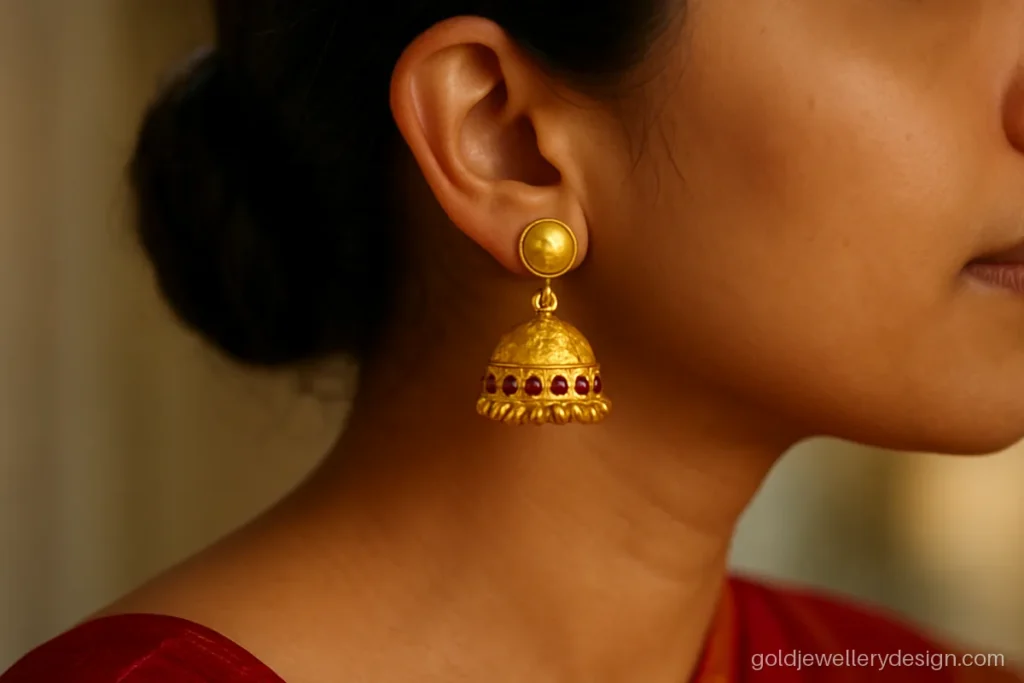 5 gram gold earrings new design, a jhumka with ruby dots worn with a saree